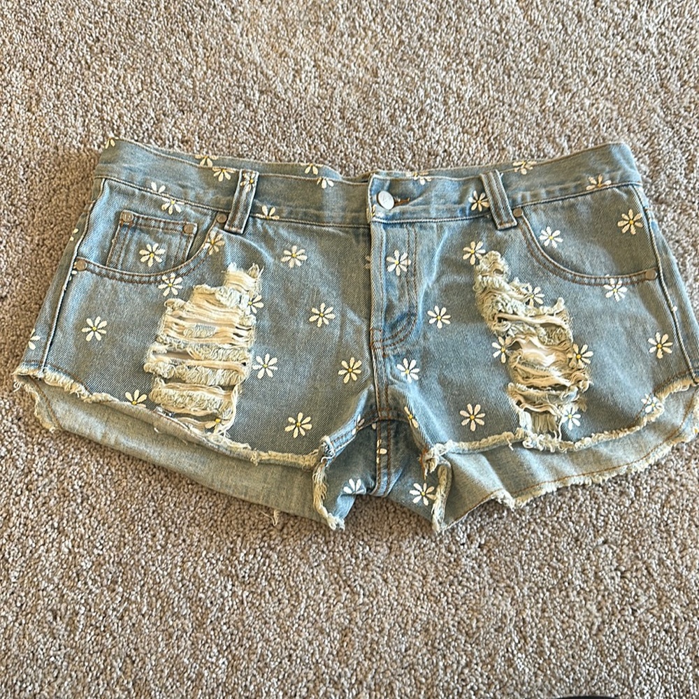 Distressed mink pink floral denim shorts